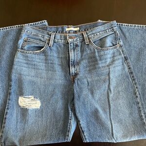 Levi’s 90’s Baggy Bootcut size 31 distressed Blue Denim Jeans
